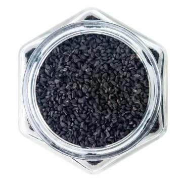 Nigella or Black cumin over white background Stock Photos