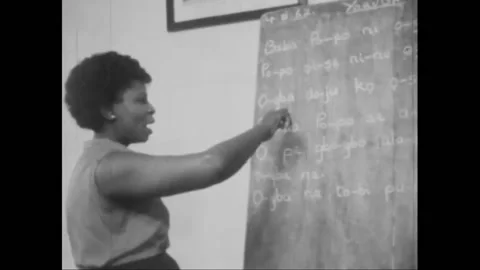 NIGERIA - 1963 - Nigerian students study Arabic scripts and Latin alphabet in Stock Footage 325207902