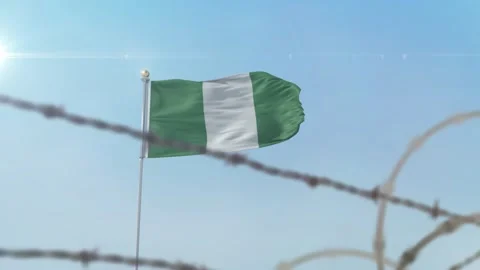 Nigeria flag behind border Stock Footage 137430409