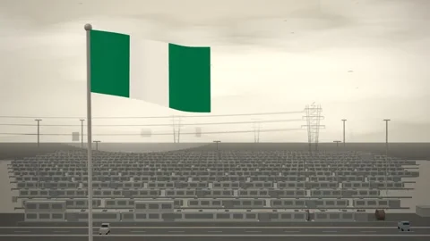 Nigeria Flag Flying Over Grid Battery Storage Farm seamless loop Stock Footage 345132906