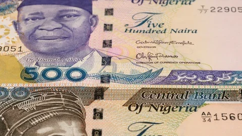 Nigeria naira notes fast tracking. Nigerian money. Slider shot, low angle. 4K Stock Footage 126004726