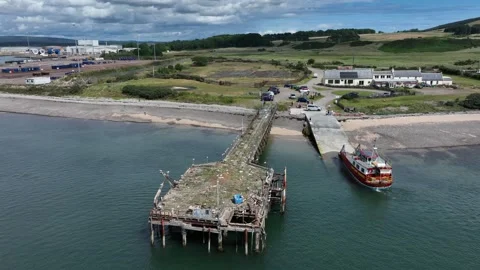 Nigg Pier and Cromarty to Nigg ferry drone aerial clip Stock Footage 247347685