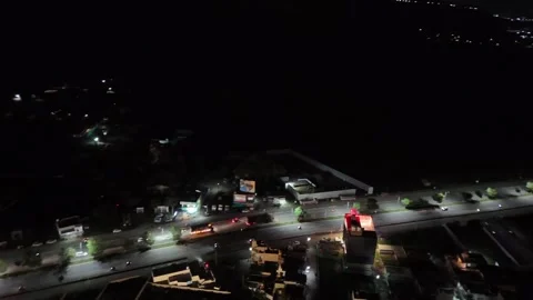 Night aerial of an event in Mysore with massive crowd and lit stage 库存影片 329745175