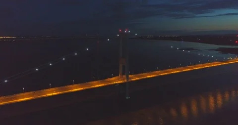 Night aerial pulling out from Severn Bridge from English side looking towards Stock Footage 112000495