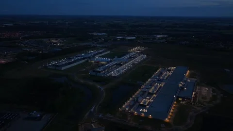 Night aerial shot of Meta data facility with bright lights. Stock Footage 318620436