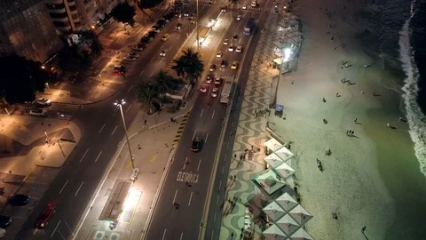 Night aerial tilting down over traffic and beach in Copacabana, Rio de Janeiro, 動画素材 101287651