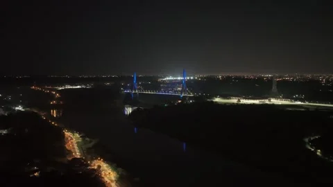 Night aerial view from Argentina of Integration Bridge lit blue over Parana Video stock 328997419