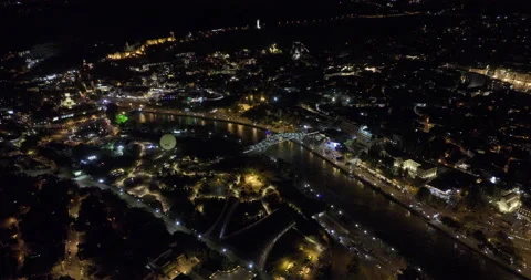 Night aerial view of Bridge of Peace and beautiful cityscape of Tbilisi Stock Footage 200540451