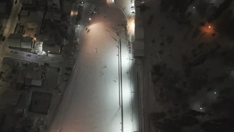 Night aerial view of illuminated ski slope during winter Stock Footage 341765519
