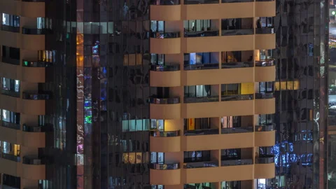 Night aerial view of office or apartment building glass window facade with Stock Footage 220132098