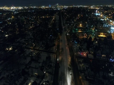 Night Aerial View of Westbound Train through Audubon and Oaklyn New Jersey Видео 71409137
