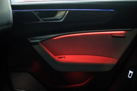 Night ambient led light inside of car interior. door card Stock Photos