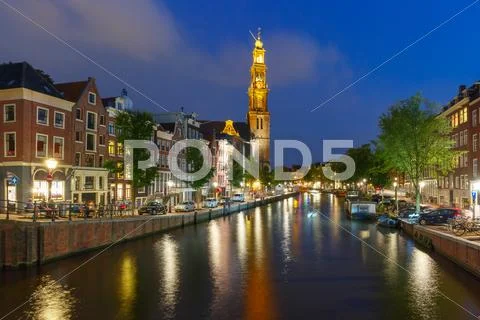 Night Amsterdam canal and Westerkerk church Stock Photos