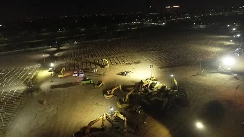 NIGHT ARIAL VIEW OF COVID 19 CEMENTERY AT ROROTAN JAKARTA, INDONESIA. Video stock 157541188