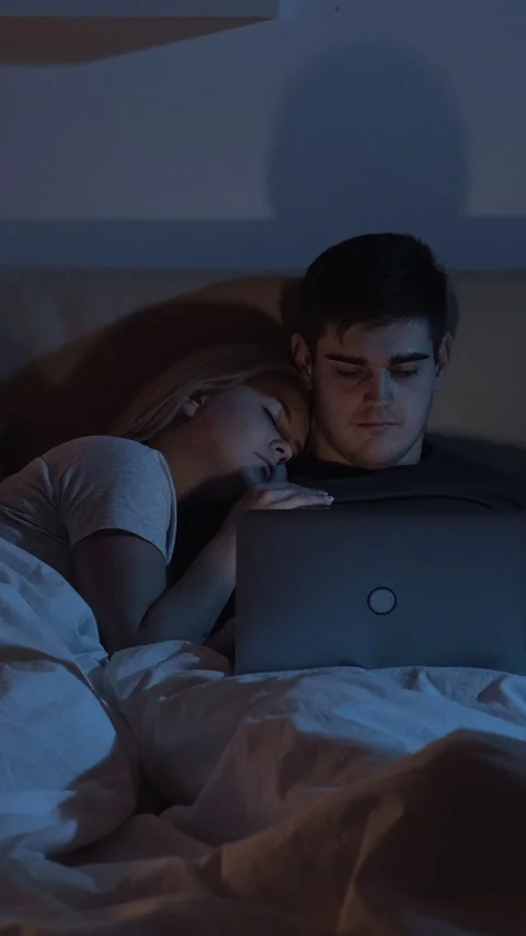 Night bed work husband using laptop late vertical Stock Footage 229866152