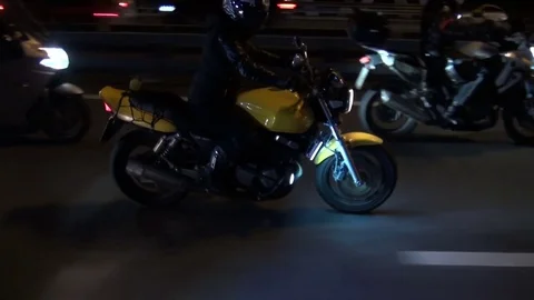 Night bikers dangerous overtaking Stock Footage 71818254