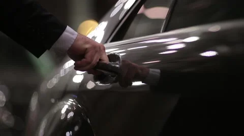 Night, black executive car suitable driver opens the door Passenger Stock-Footage 50166853