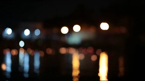 Night bokeh from lights and water reflections. Panorama. Video stock 77233853