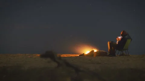 Night bonfire on the edge of the world Stock-Footage 63304409