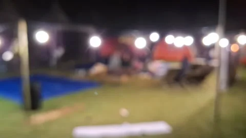 Night Camping Scene Under the Stars: Illuminated Tents and Festive Atmosphe.. Video stock 296938341