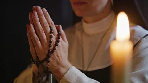 Night candle nun praying religious person heaven and hell Stock Photos