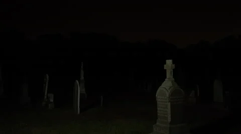 Night  cemetery graveyard headstones graves Stock Footage