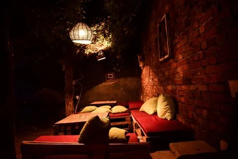 Night in charming yard with nice handmade furniture Stock Photos