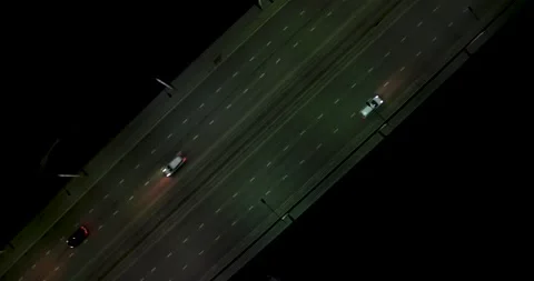 Night city. Cars are moving across the bridge. Shooting from a drone. Stock Footage