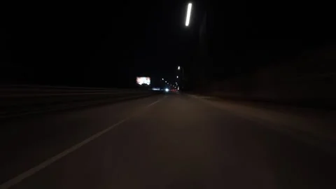 Night city drive hyperlapse with motion blur and light trails, filmed from a Stock Footage 324707412