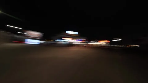 Night city drive hyperlapse with motion blur and light trails, filmed from a Stock Footage 324727978