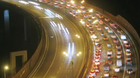 Night city: illuminated bridge with traffic. Timelapse Stock Footage