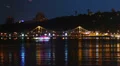 Night city life, quay, bridge, ferry, air balloons flying, stars HD Footage