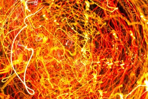 Night city lights diffused with camera motion and zoom out on long exposure. Stock Photos