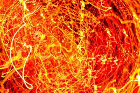 Night city lights diffused with camera motion and zoom out on long exposure. Stock Photos