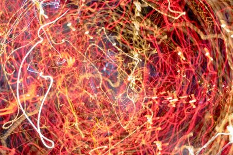 Night city lights diffused with camera motion and zoom out on long exposure. Stock-Fotos