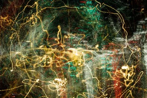 Night city lights diffused with camera motion and zoom out on long exposure. Stock Photos