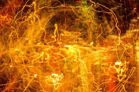 Night city lights diffused with camera motion and zoom out on long exposure. Foto stock