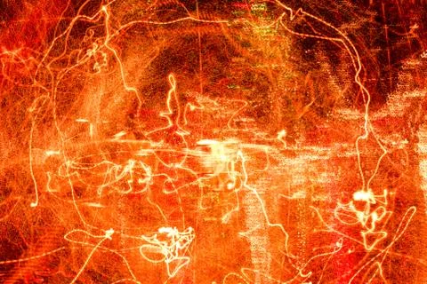 Night city lights diffused with camera motion and zoom out on long exposure. Stock Photos