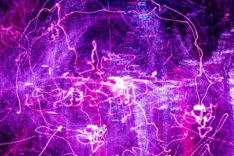 Night city lights diffused with camera motion and zoom out on long exposure. Stock Photos