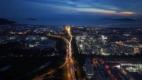Night city lights glow under twilight skies Stock Footage 341720073