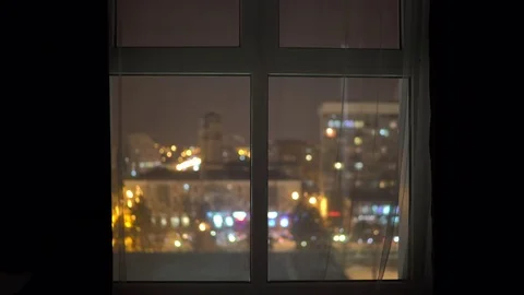 Night city lights high rise apartment window view Stock Footage