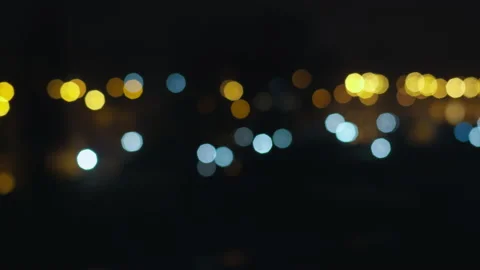 Night city lights in an open window, blurred background Stock Footage 154183290