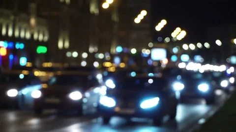 Night city lights. Reflection of car headlights on the road. Traffic jam blur Stockbeeldmateriaal 69099676