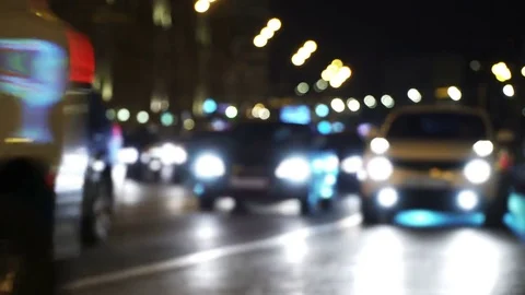 Night city lights reflection to the passing cars. Traffic jam in blur closeup Stock Footage 69084318