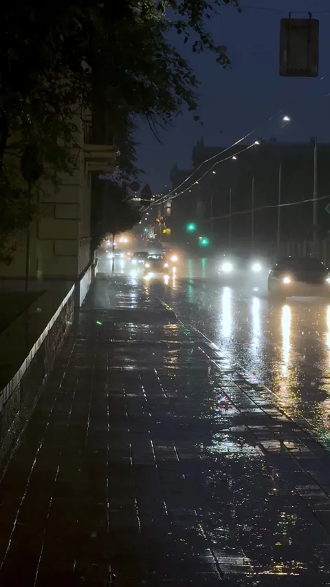 Night city scene during heavy rain, slow motion raindrops,Vertical 9:16 video Stock Footage 340516306