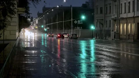 Night city scene during heavy rain, slow motion raindrops and water streams Stock Footage 340516571