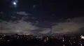 Night city timelapse, houses buildings shine lights, clouds move HD Footage