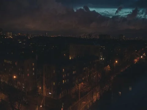 Night city traffic with dramatic clouds, time lapse Stock Footage 74793633