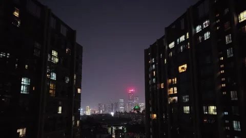 Night city transition. Camera move between Illuminated buildings. Cityscape view Stock Footage 330519594