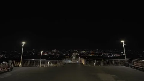 Night city view from a dark observation deck with lamps Stock Footage 333009648